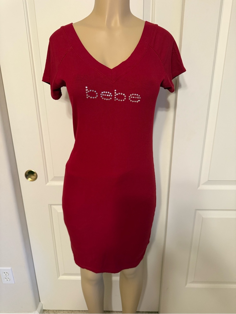 bebe Red Ribbed V‑Neck Short Sleeve Mini Dress with Rhinestone Logo